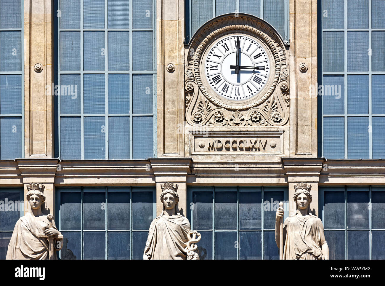 France, Paris, station building, facade, statues, clock 15 o'clock Stock Photo