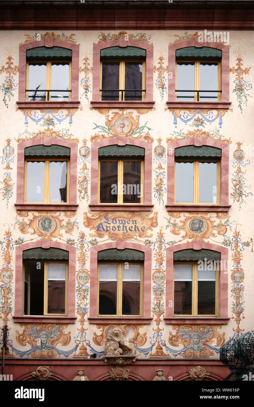 The facade of the historical LÃ¶wen pharmacy in Mainz painted with flora and famous heads Stock Photo