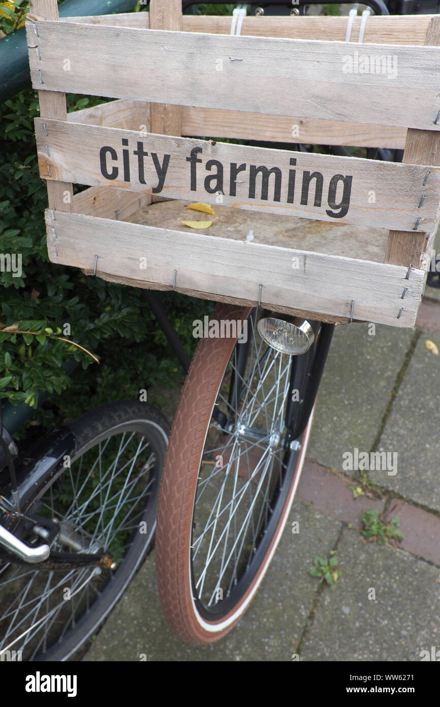 Bicycle, wooden box, writing, city farming, modern food sale Stock Photo