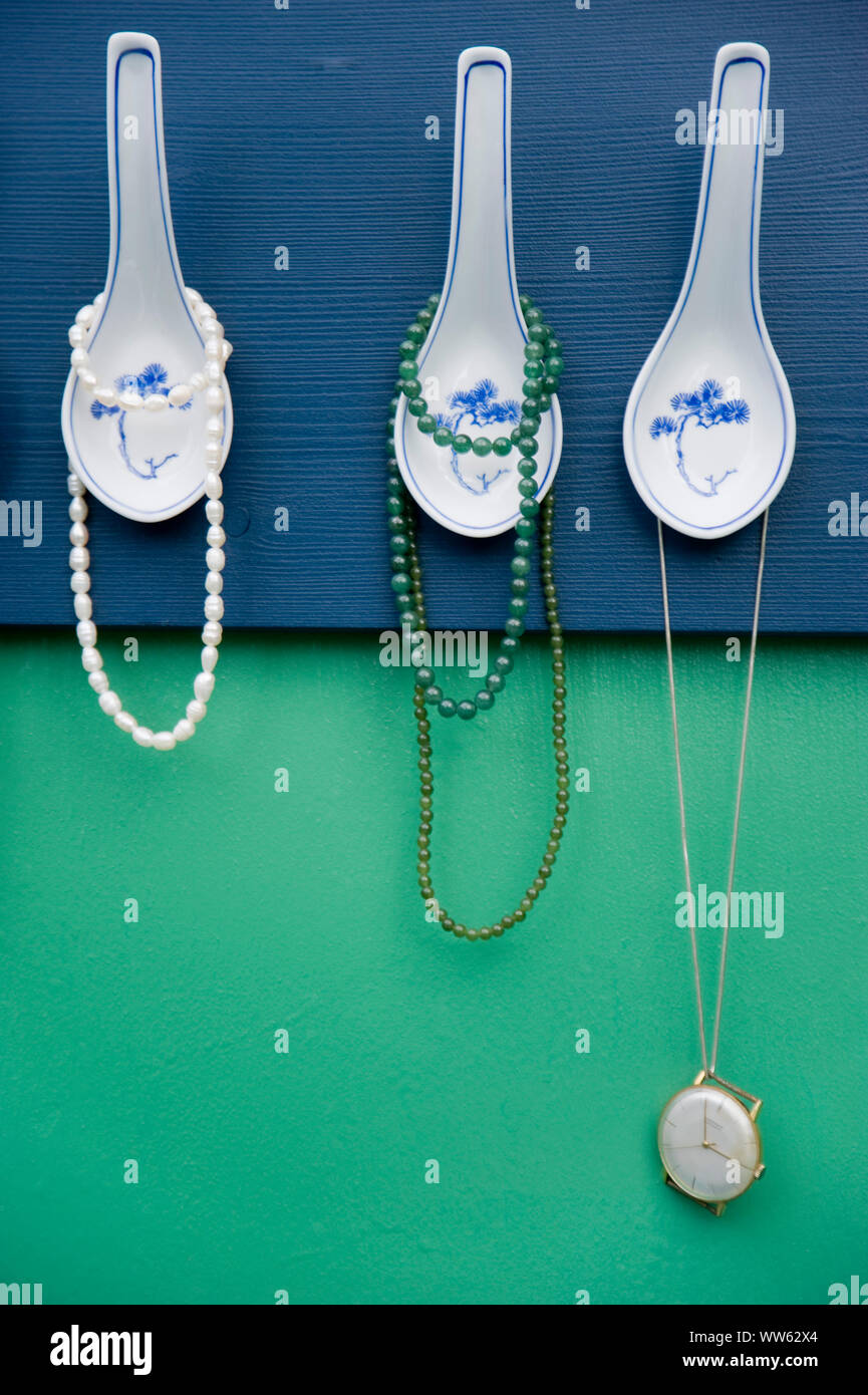 DIY coatrack from Asian spoons, jewellery Stock Photo