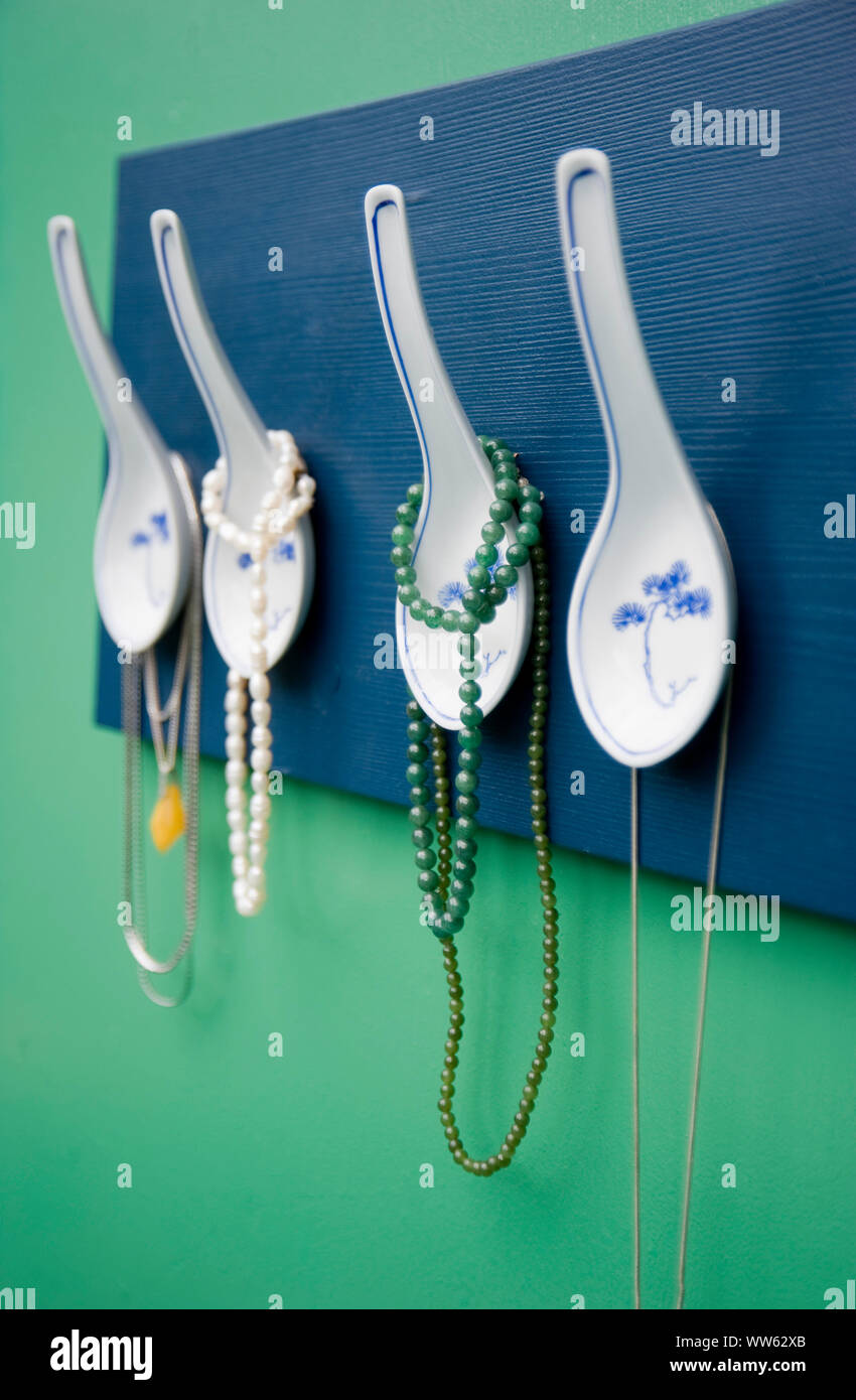 DIY coatrack from Asian spoons, jewellery Stock Photo