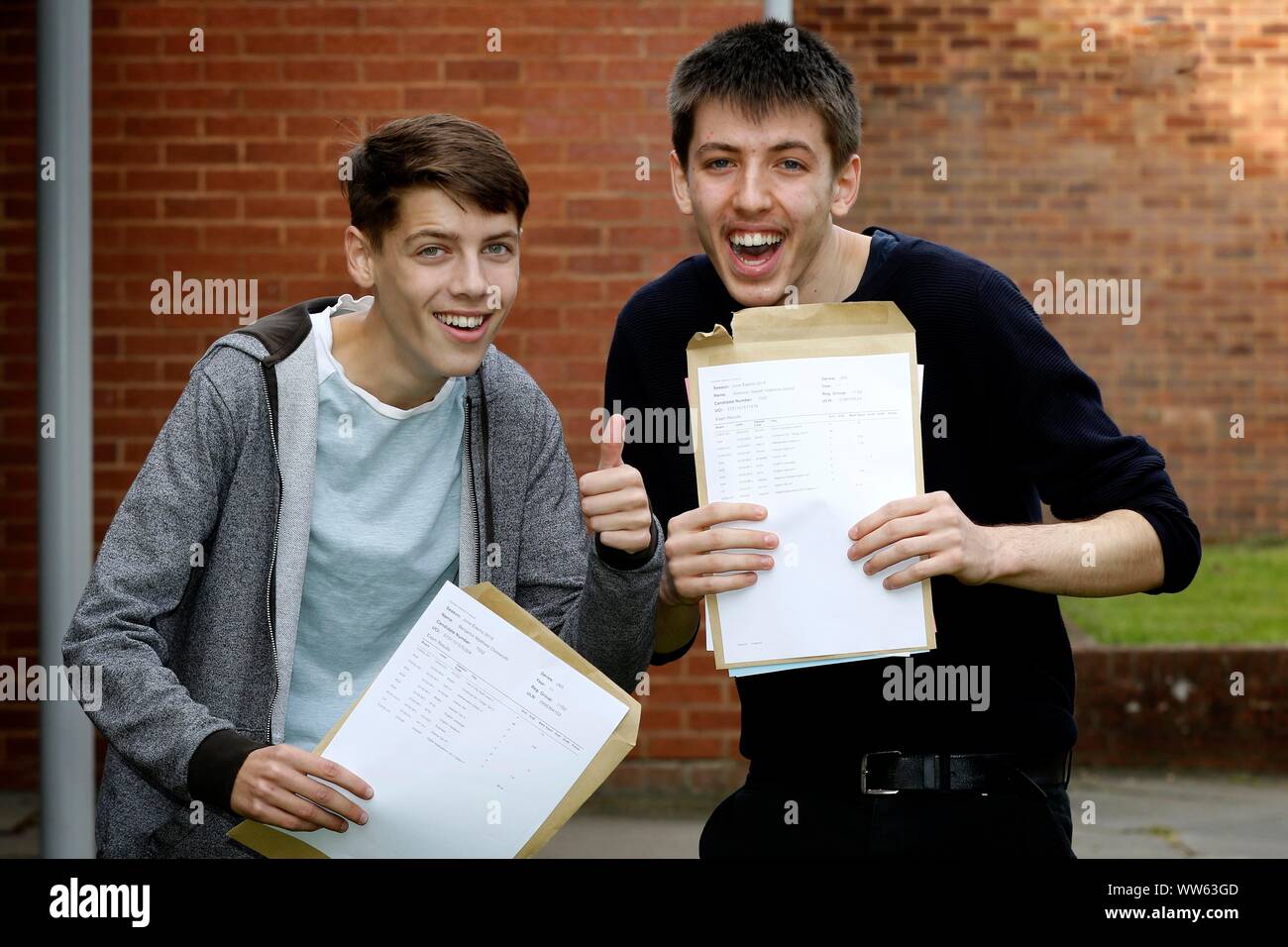 Friends Benjamin Chesworth (five 9s and two A*) and Solomon Vallence-Jones (seven 9s, 8 and A*) happy guys at GCSE results day at Balcarras Academy, C Stock Photo