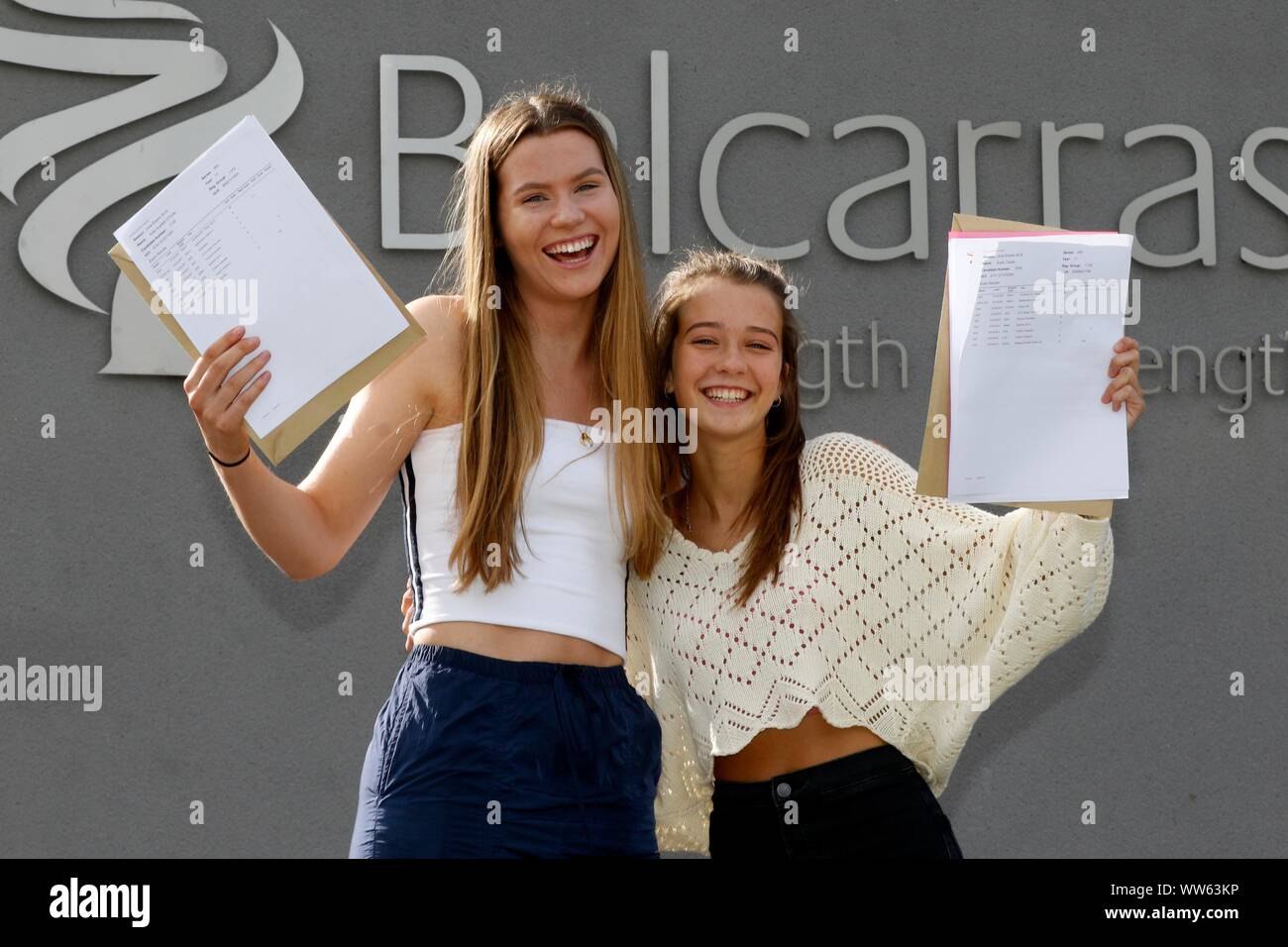 Kate O'Toole, who got five 9 grades and friend Katie Castle, who got three 9 grades, at GCSE results day at Balcarras Academy, Cheltenham. 22/08/2019 Stock Photo