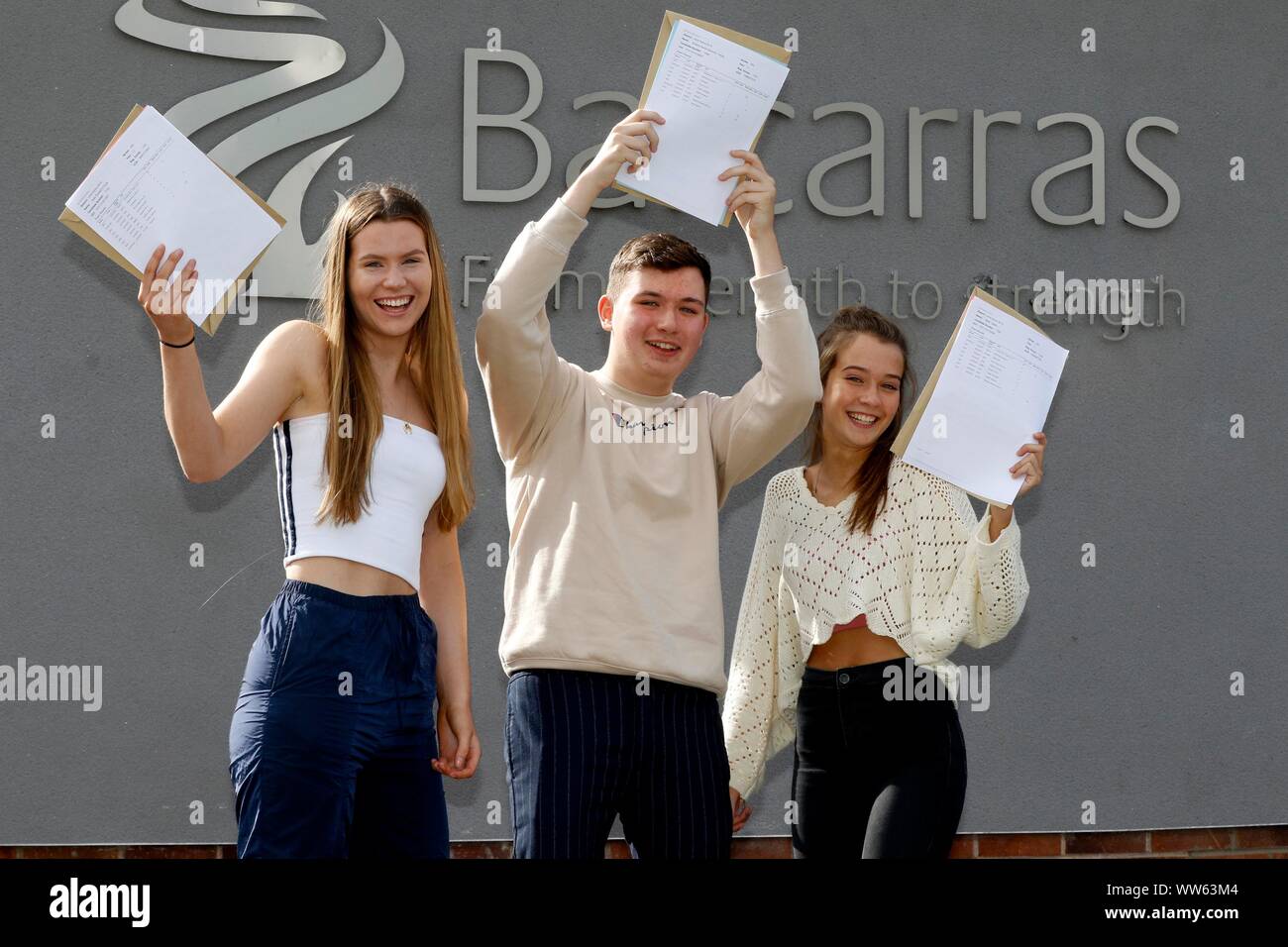 Kate O'Toole, who got five 9 grades, Teddy Holbrook, who got an A* and five 8 grades, and Katie Castle, who got three 9 grades, at GCSE results day at Stock Photo