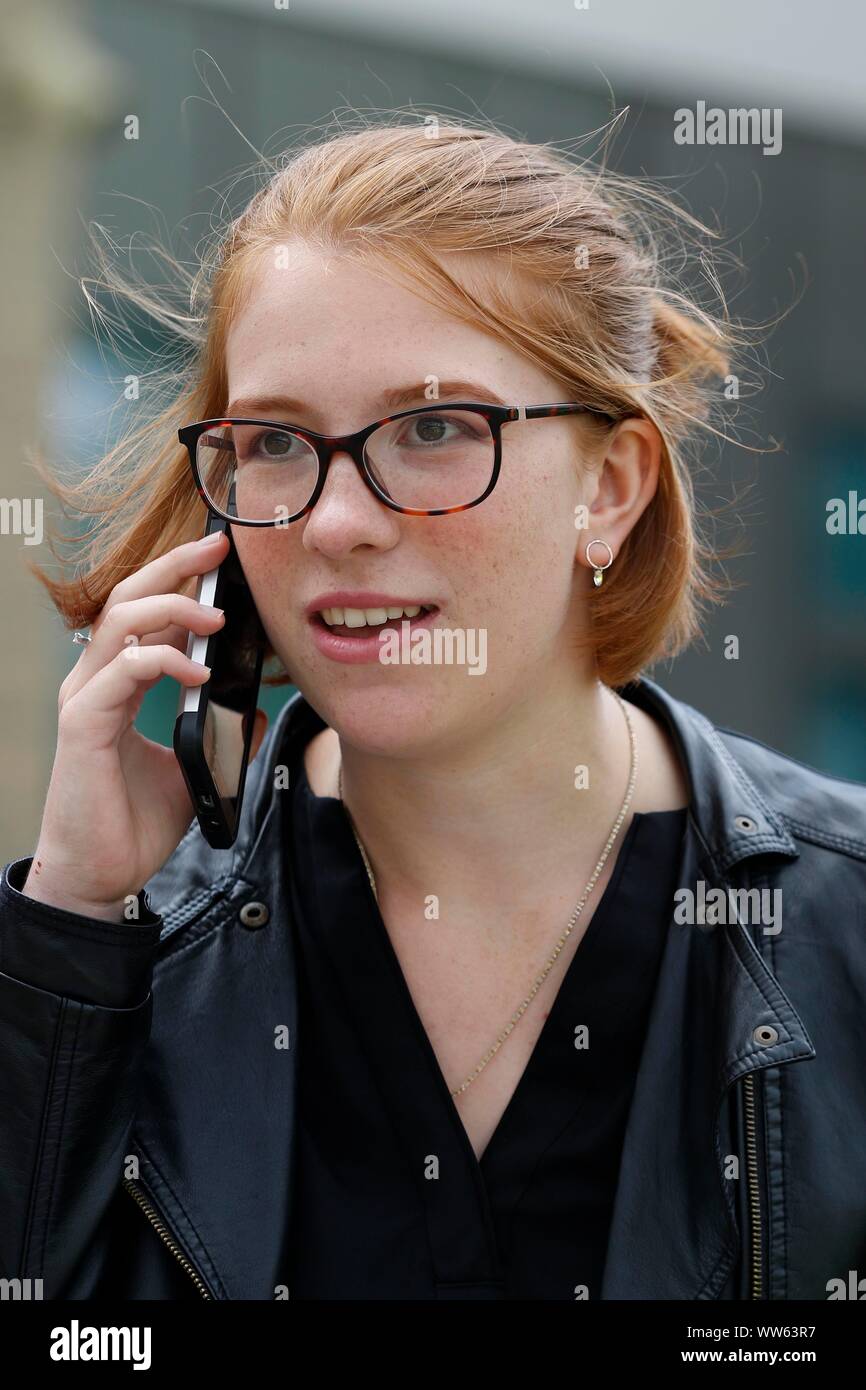 Phoning Mum, Amie Adcock (three 9s, and five 8 grades) at GCSE results day at All Saints Academy, Cheltenham. 22/08/2019 Picture by Andrew Higgins - T Stock Photo