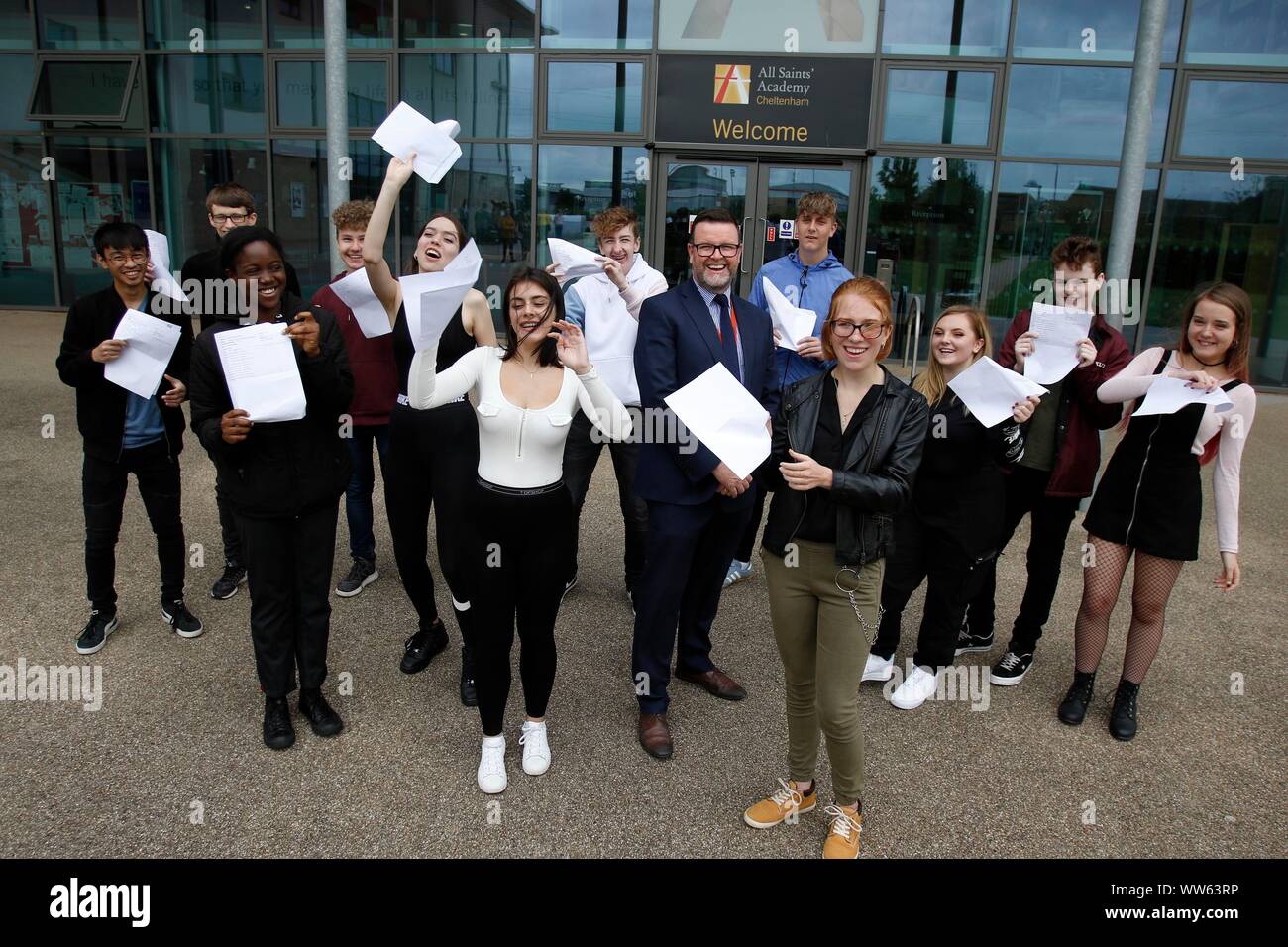 Dermot McNiffe, principal, with some of his successful pupils at GCSE results day at All Saints Academy, Cheltenham. 22/08/2019 Picture by Andrew Higg Stock Photo