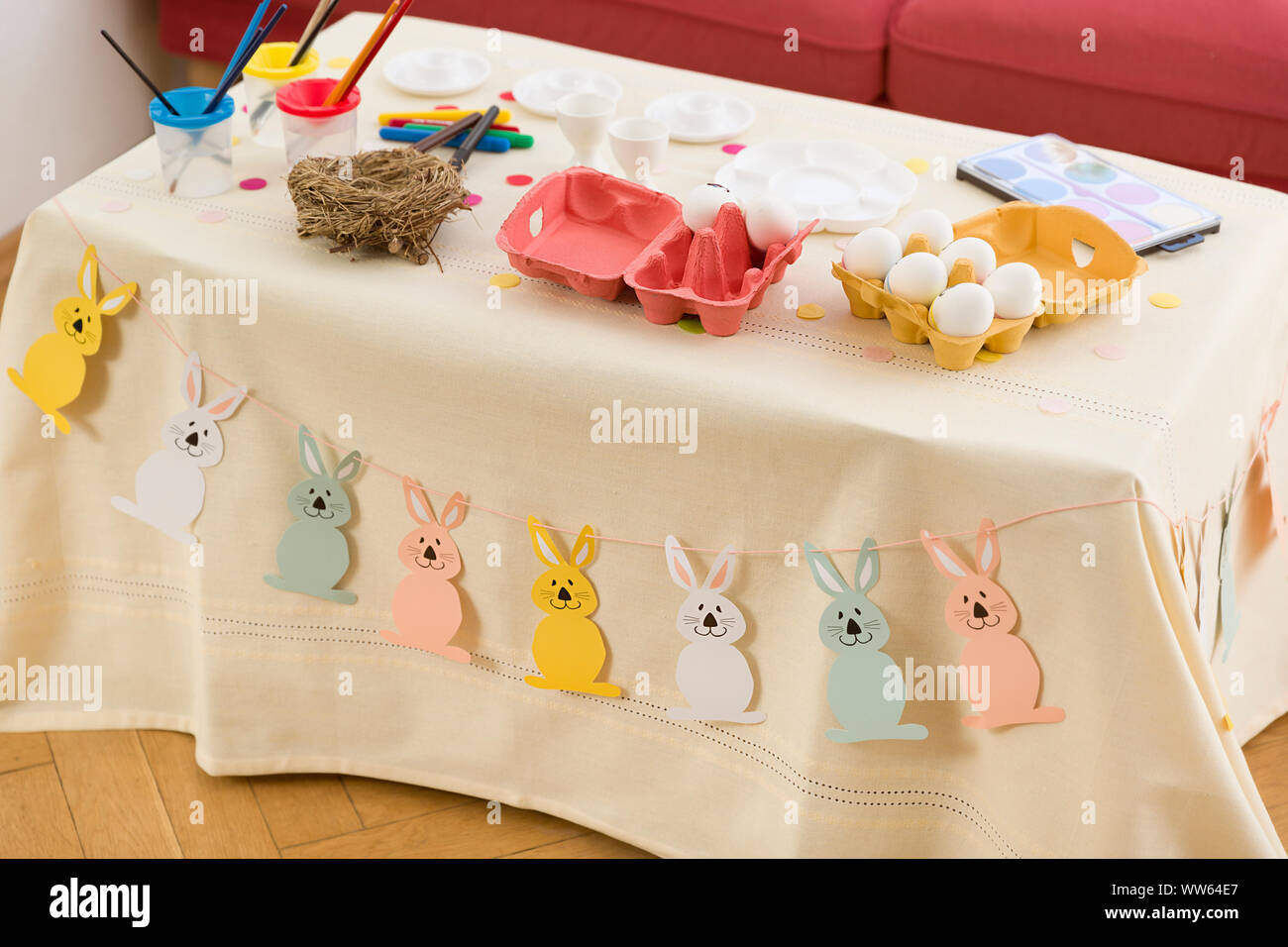 Coffee table, dyeing Easter eggs, accessories, paint, eggs, Egg carton Stock Photo