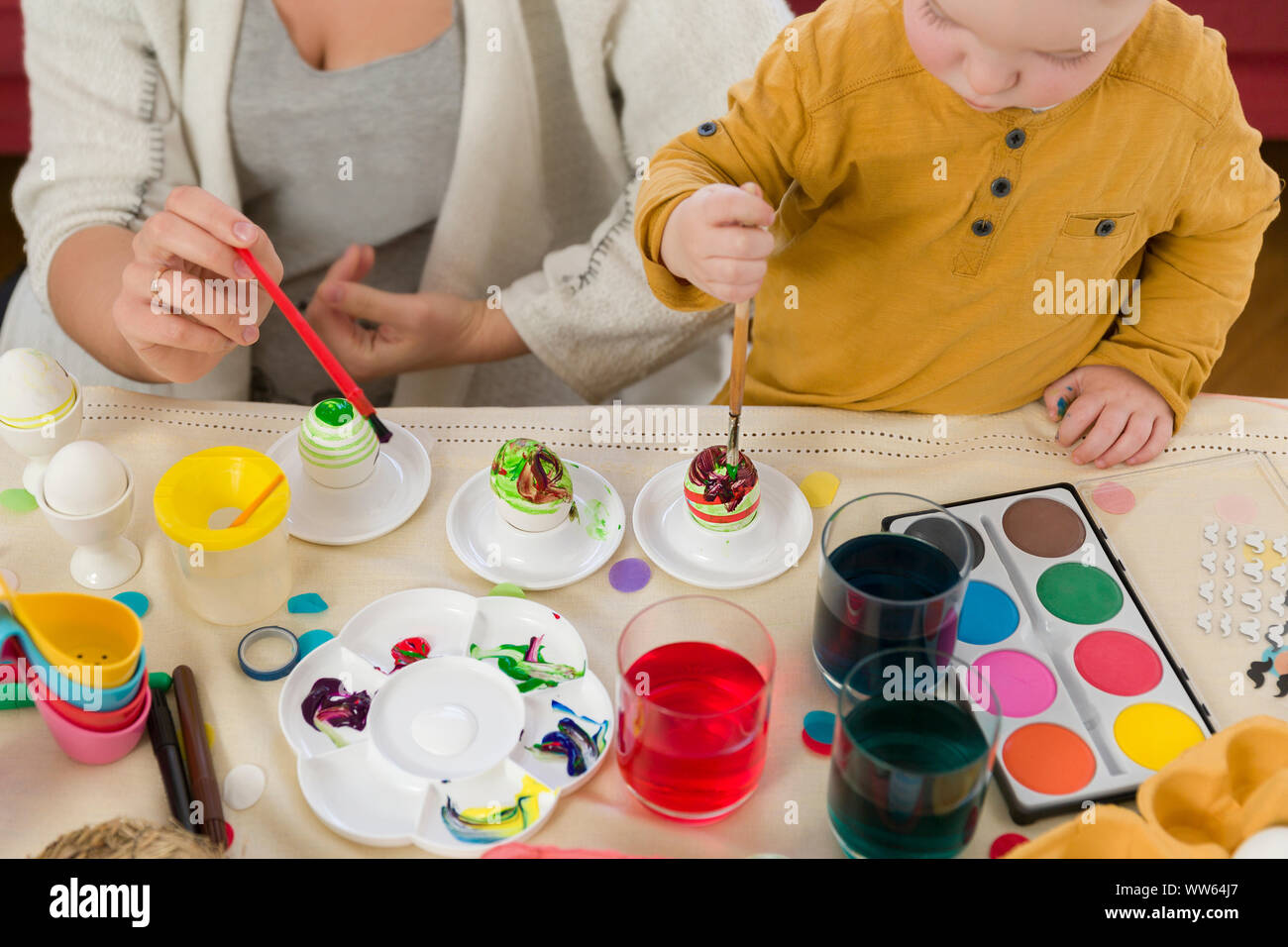 Mother, boy, toddler, Easter eggs, painting, dyeing Stock Photo