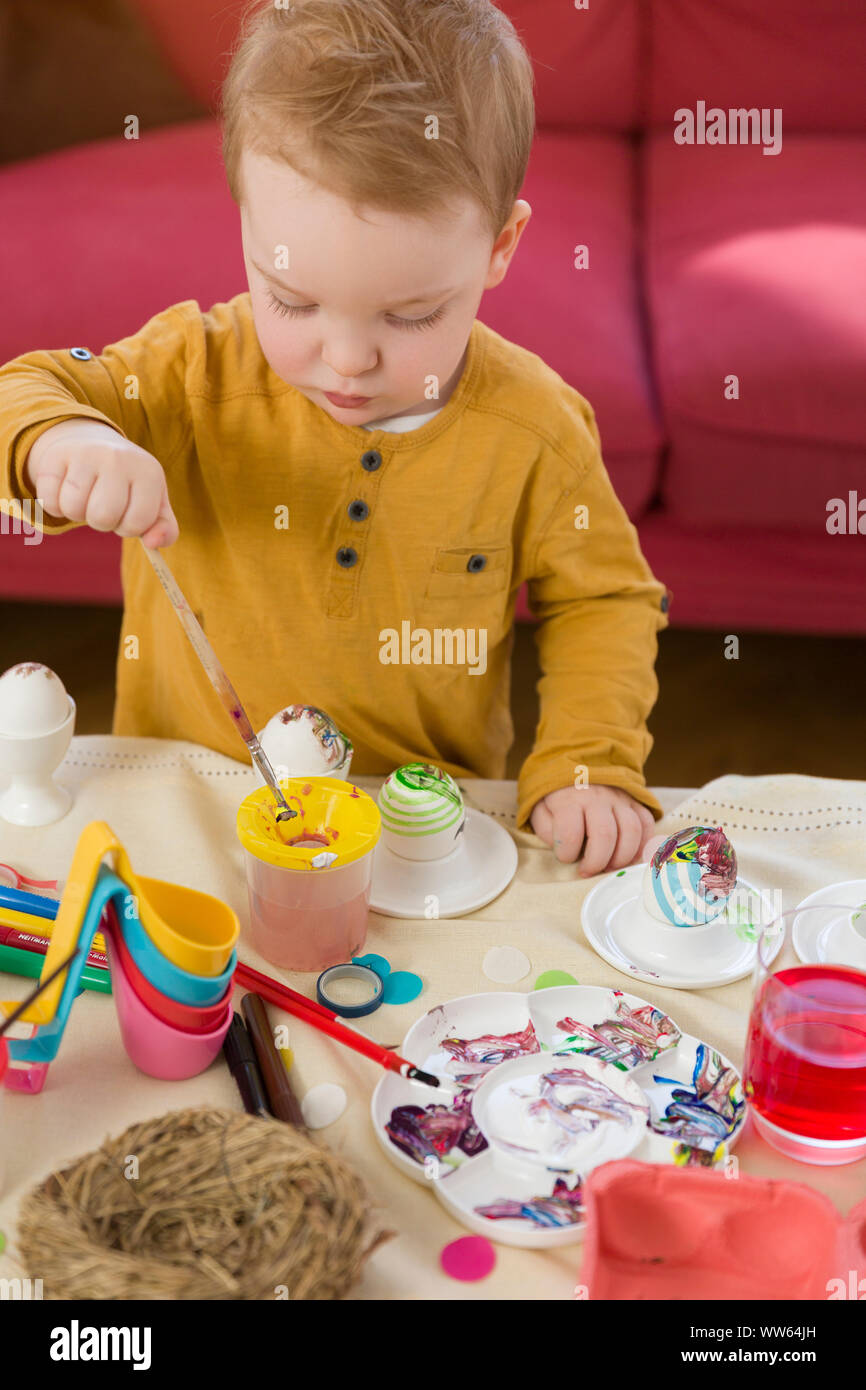 Toddler, Easter egg, painting Stock Photo