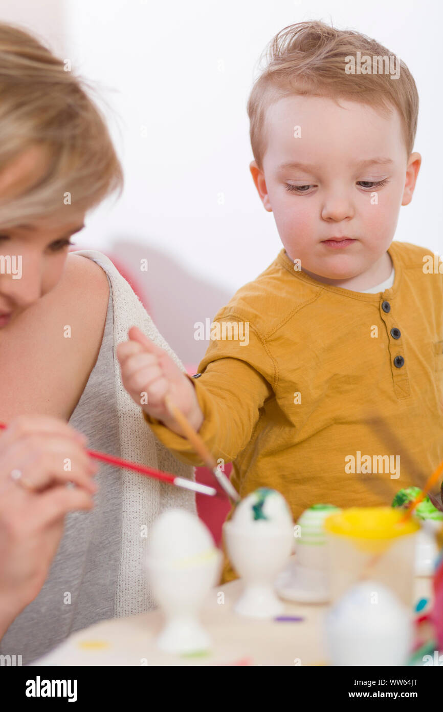 Mother, toddler, Painting Easter eggs Stock Photo