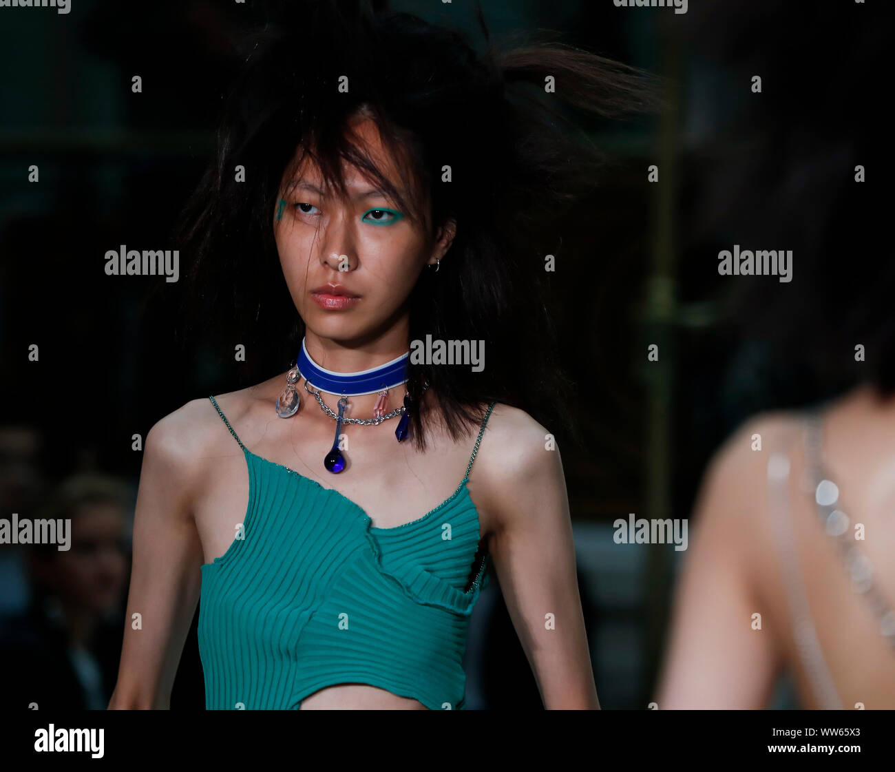 London, UK. 13th Sep, 2019. A model presents the creation of Jamie Wei