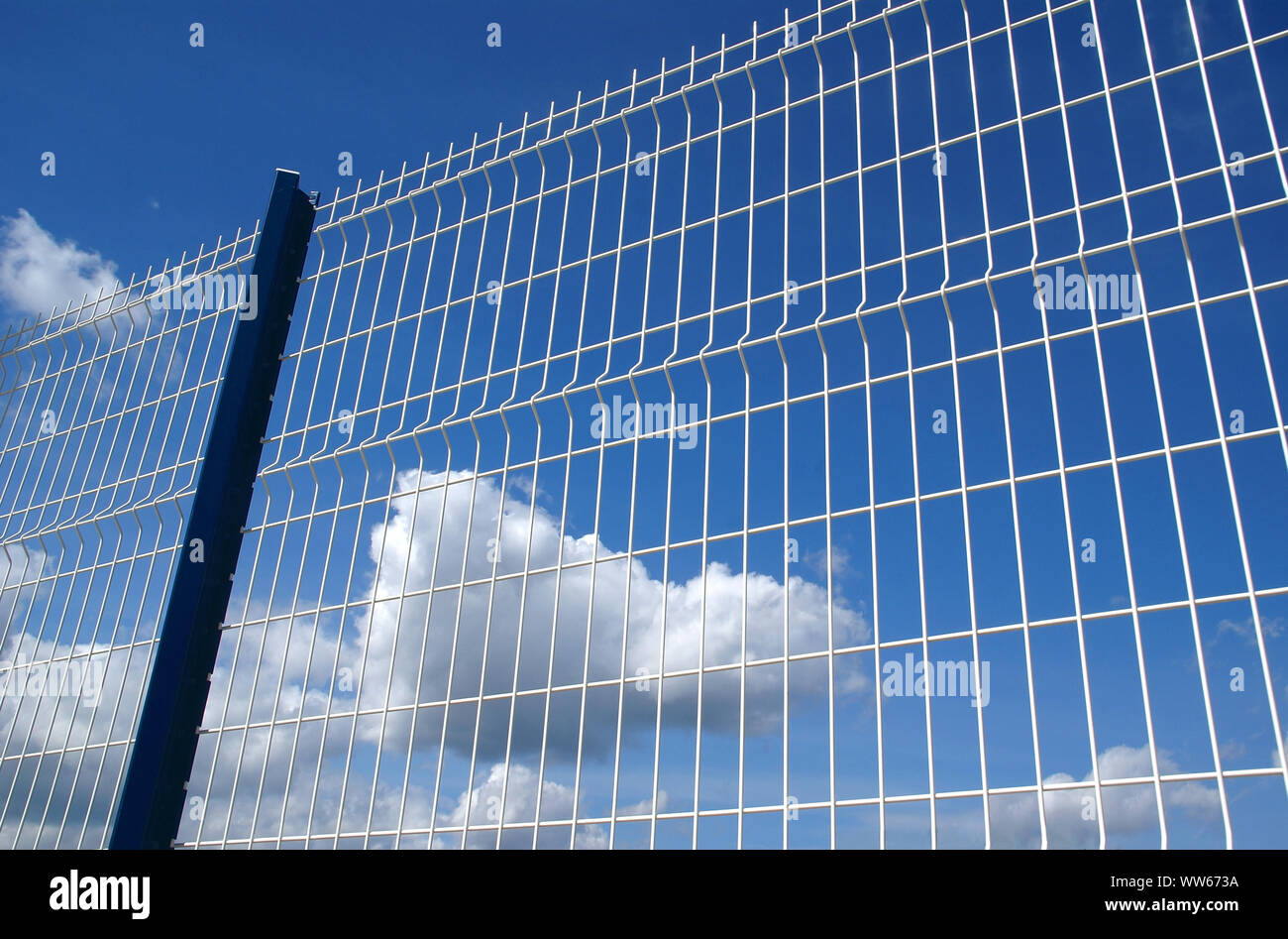 White metal fence on blue sky Stock Photo - Alamy