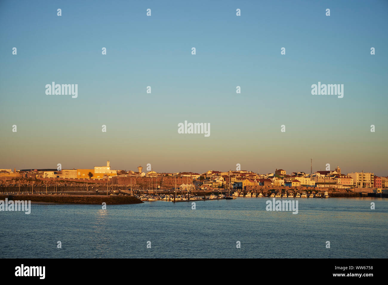 Town Peniche with harbour in the morning, sunrise, blue sky Stock Photo