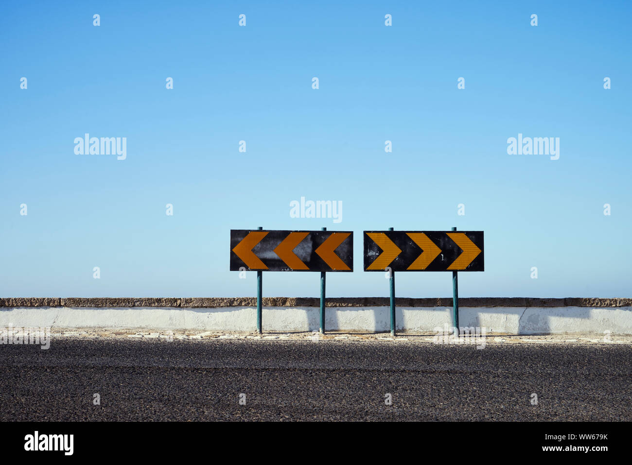 Road sign with direction right left on a street Stock Photo