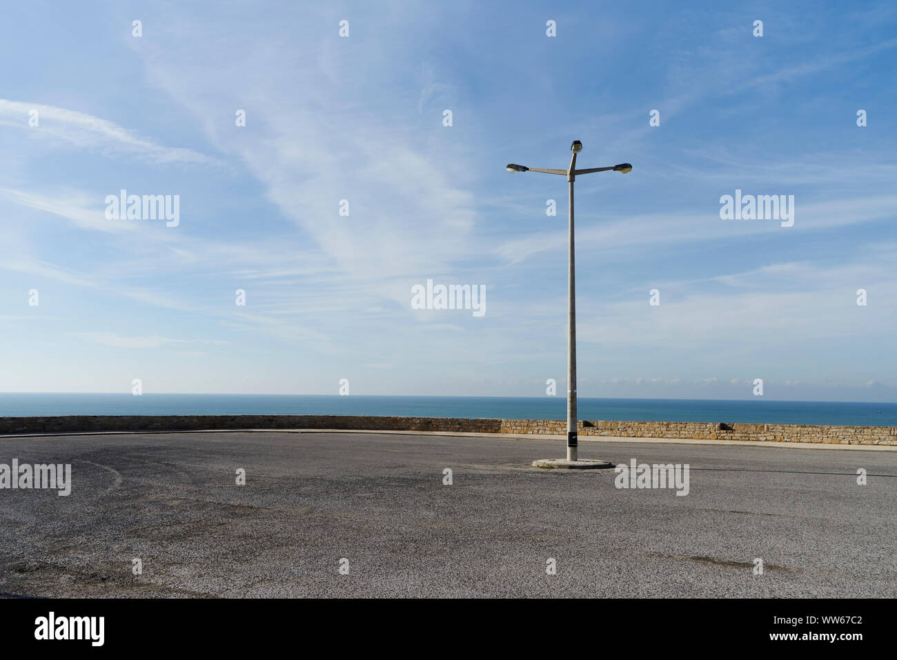 empty parking lot with street lamp on the shore Stock Photo