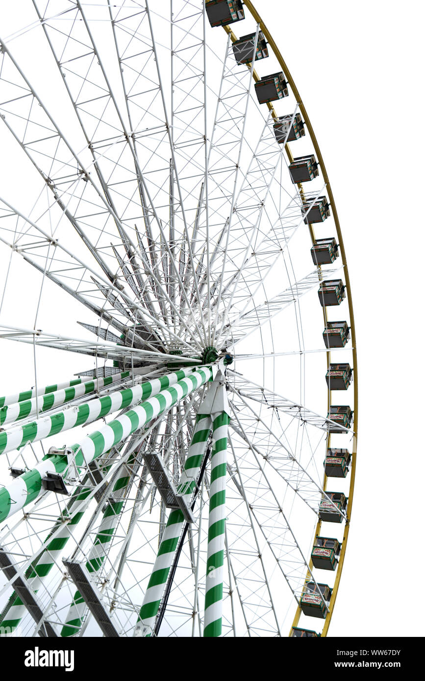 Ferris wheel with gondola in worm's eye view in front of white sky, cut out Stock Photo