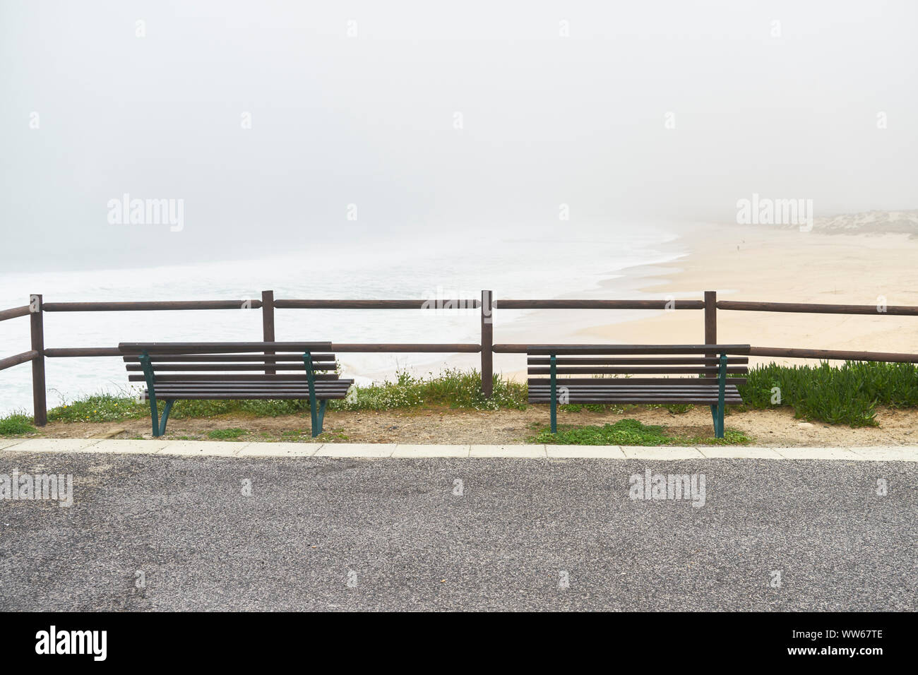 two benches on lookout on the beach, sea, fog Stock Photo