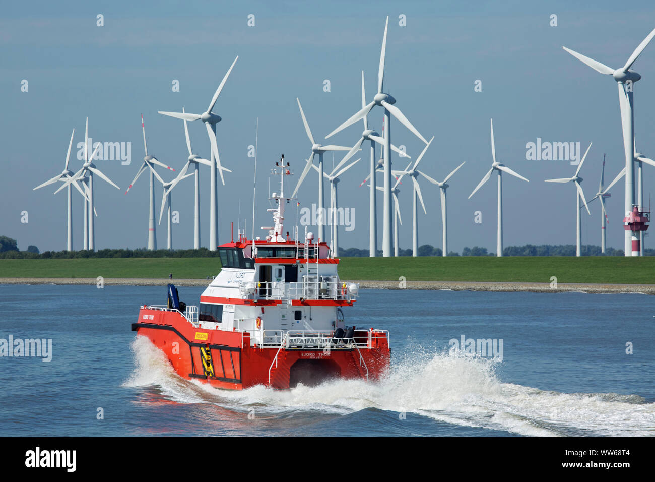 The Offshore crew boat Njord Thor on Dollart (Ems mouth) in front of a wind park near Emden. Stock Photo
