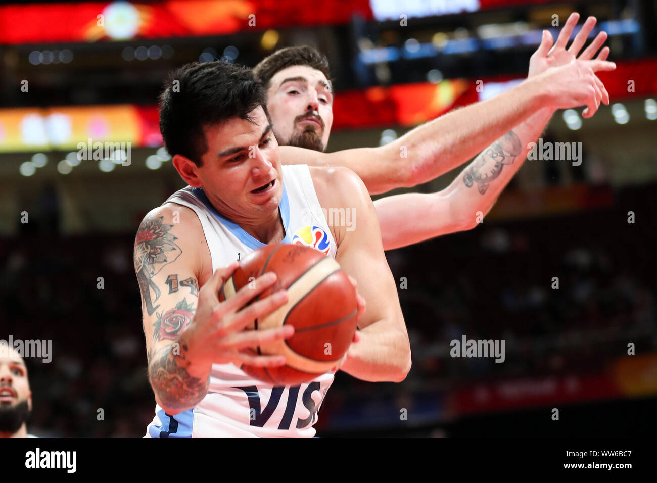 Beijing, China. 13th Sep, 2019. Gabriel Deck (front) of Argentina grabs the ball during the semifinal match between Argentina and France at the 2019 FIBA World Cup in Beijing, capital of China, Sept. 13, 2019. Credit: Meng Yongmin/Xinhua/Alamy Live News Stock Photo