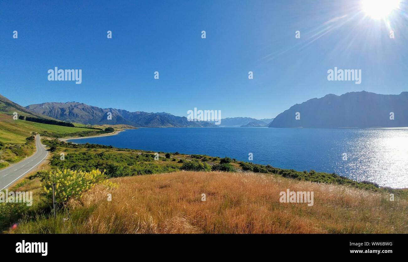 Road at the lake, Lake Hawea, along, New Zealand Stock Photo