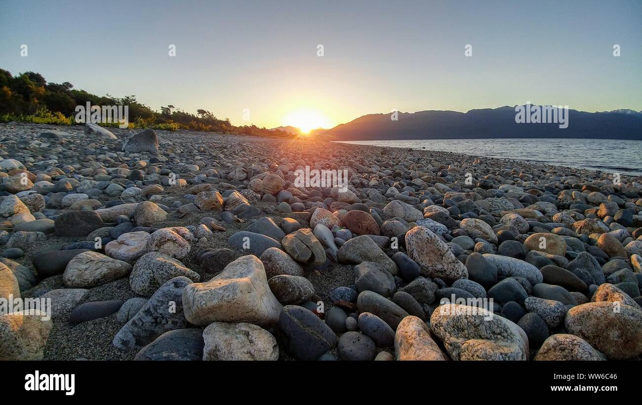 Sunset at Stone Beach, New Zealand Stock Photo