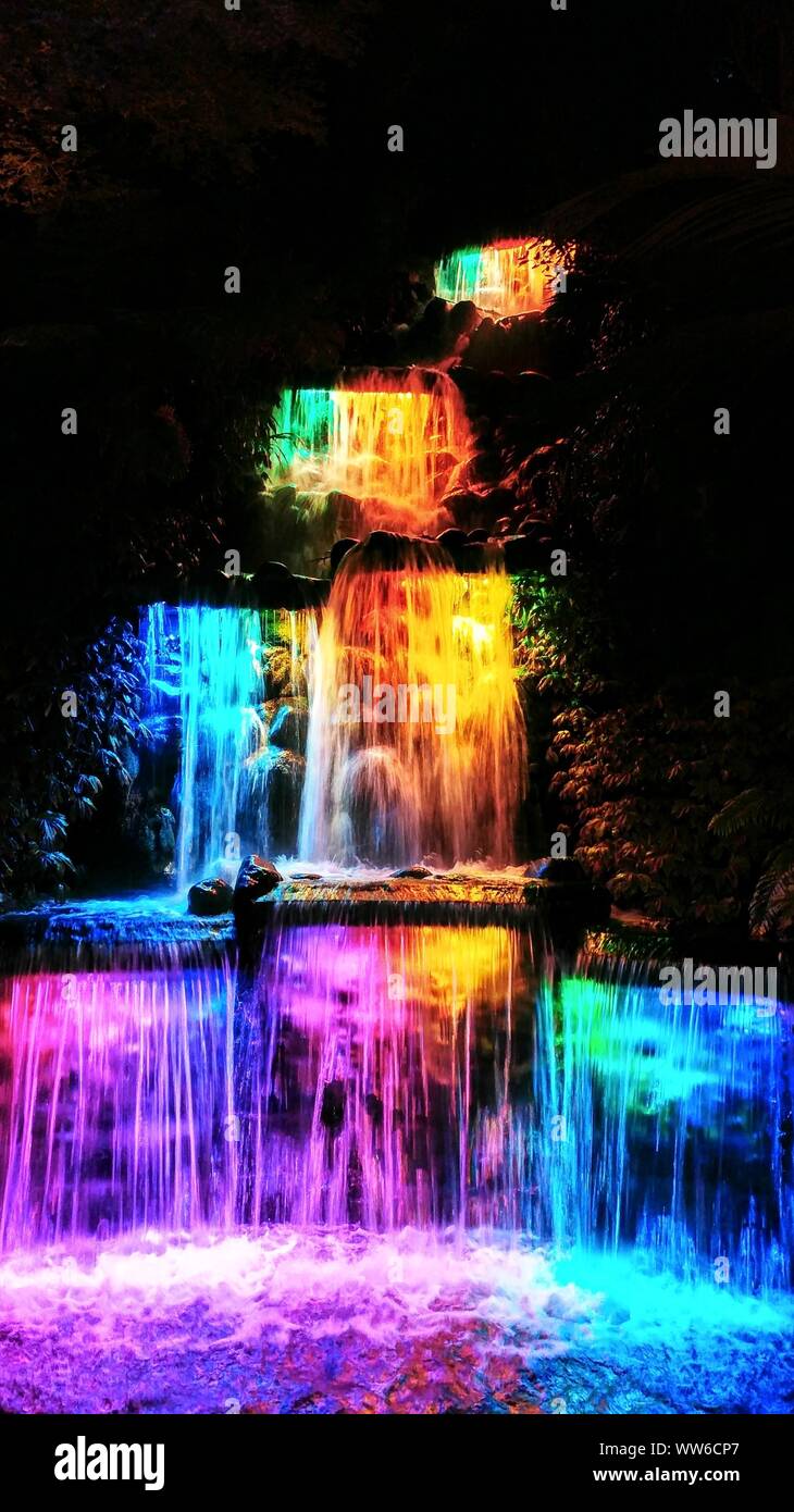 Colorful lighted waterfall in Pukekura Park, New Zealand Stock Photo