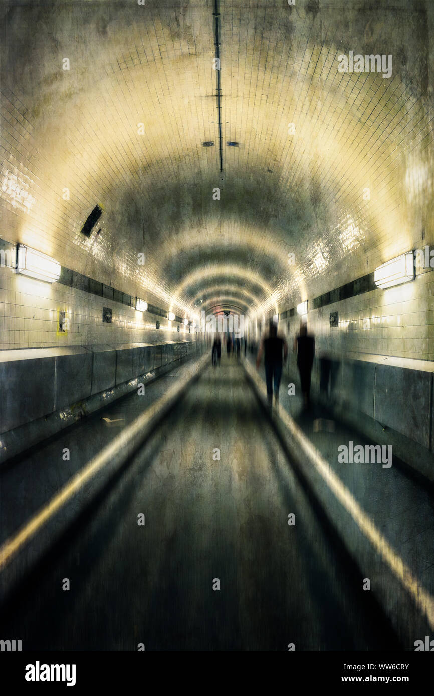 Long, dark tunnel with motion blur and texture enhancement Stock Photo