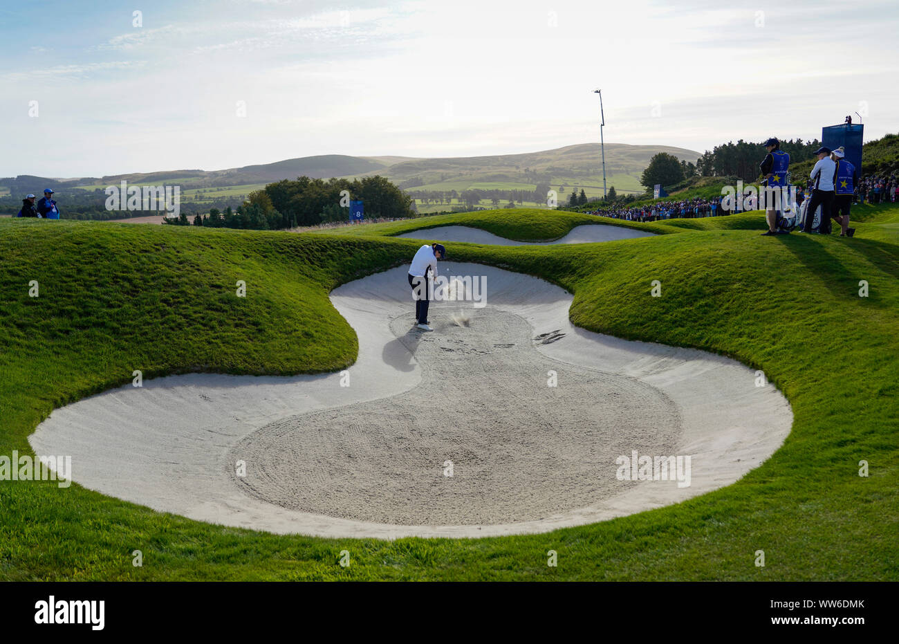 Auchterarder, Scotland, UK. 13 September 2019. Friday Foresomes matches on Friday Morning at 2019 Solheim Cup on Centenary Course at Gleneagles. Pictured; Caroline Masson of Europe plays bunker shot on 8th hole. Iain Masterton/Alamy Live News Stock Photo