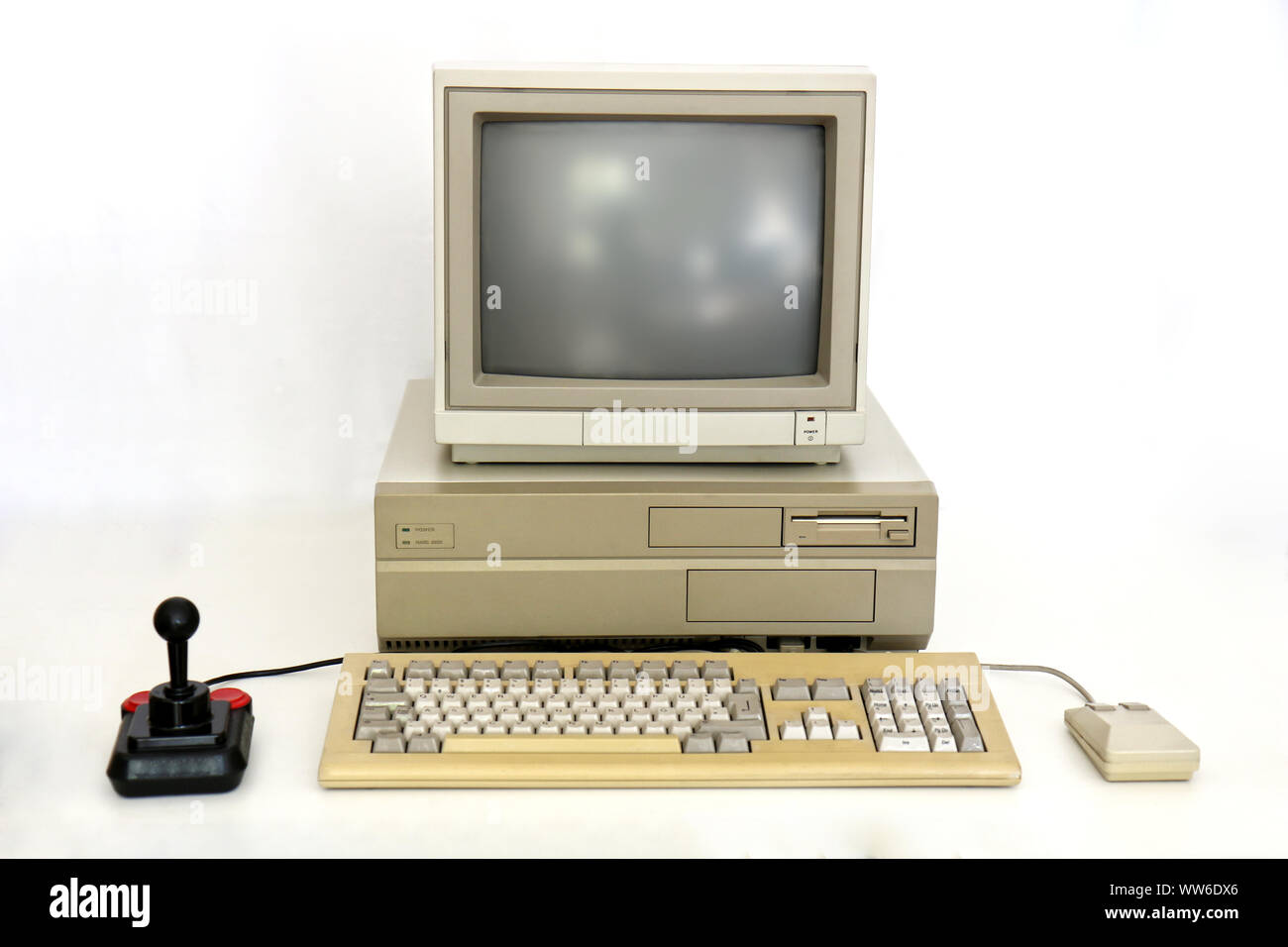 Classic Retro PC from the Eighties with Monitor, Mouse and Joystick. Used for Gaming, Writing and Graphics on White. Stock Photo