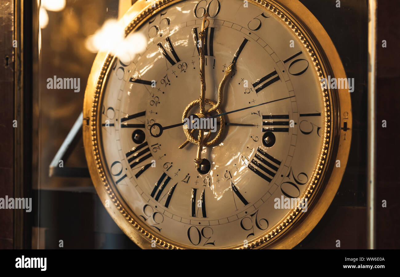 Vintage grandfather clock with white dial. Close up photo Stock Photo