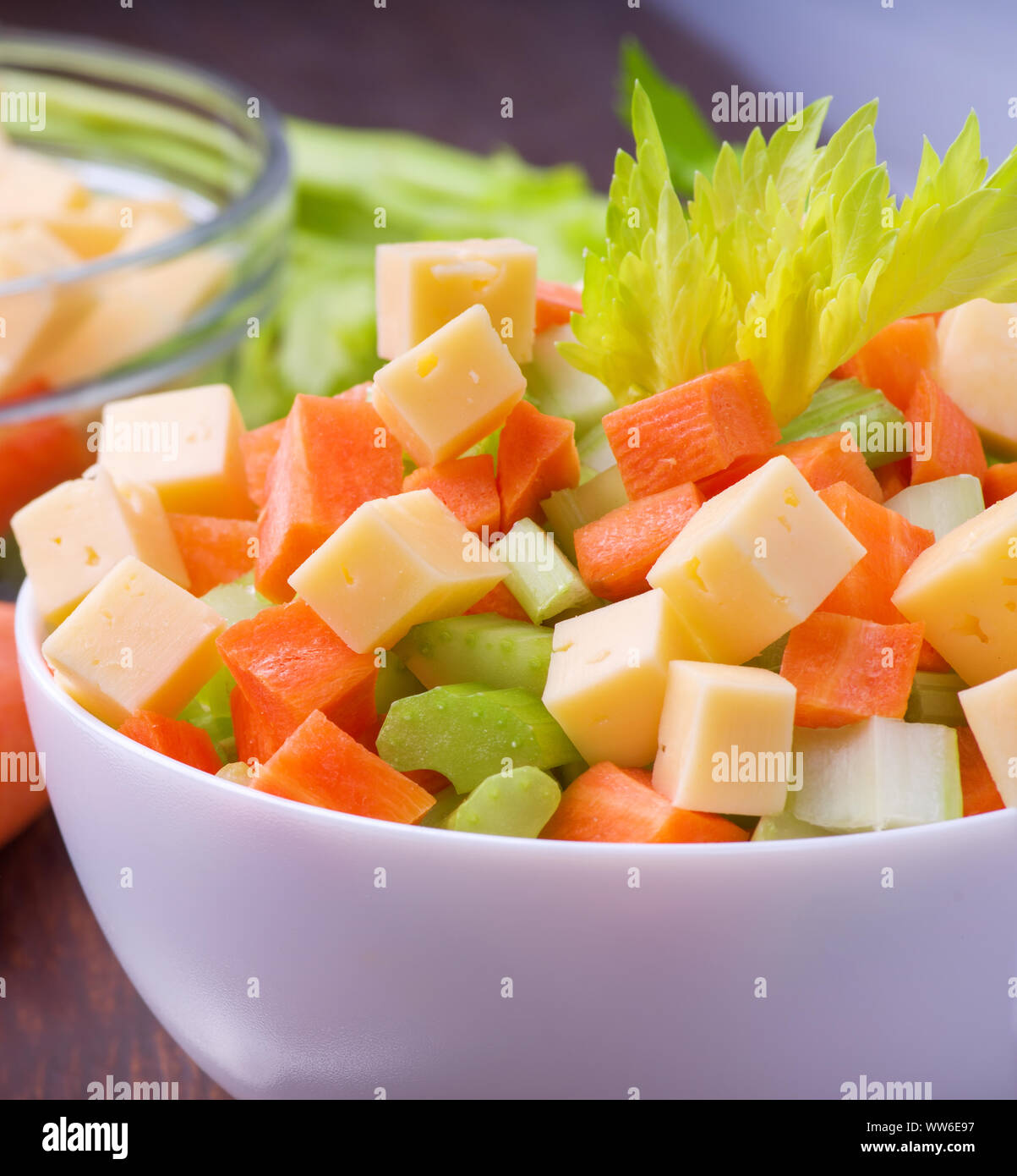 Fresh salad from stalks of celery, carrots, apples and cheese. Fitness breakfast, healthy. Stock Photo
