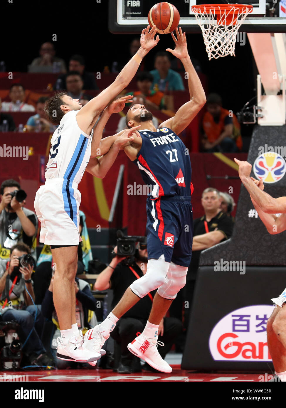 Beijing, China. 13th Sep, 2019. Rudy Gobert (R) of France vies for the ball during the semifinal match between Argentina and France at the 2019 FIBA World Cup in Beijing, capital of China, Sept. 13, 2019. Credit: Meng Yongmin/Xinhua/Alamy Live News Stock Photo