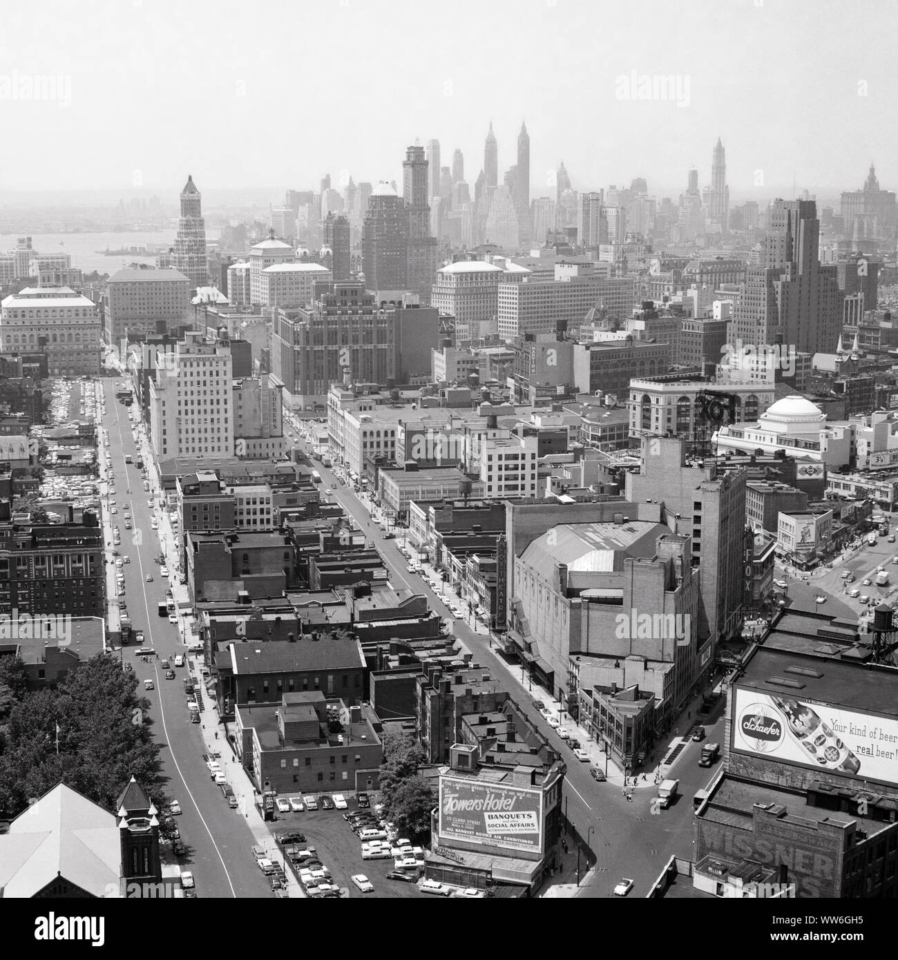 1950s DOWNTOWN BROOKLYN WITH MANHATTAN SKYLINE ON THE HORIZON VIEW