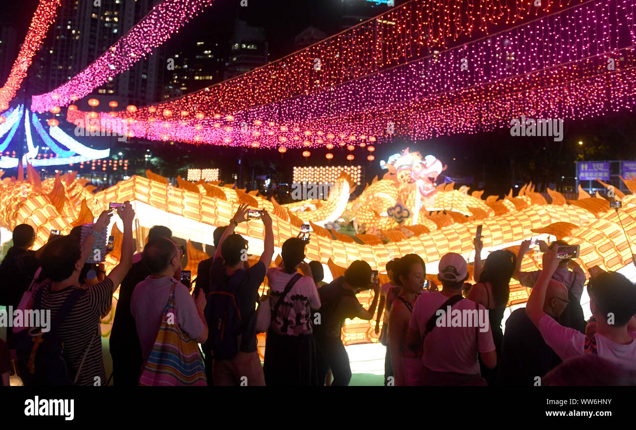 Hong Kong, China. 13th Sep, 2019. People view lanterns at a lantern fair celebrating the Mid-Autumn Festival at Victoria Park in Hong Kong, south China, Sept. 13, 2019. Credit: Lu Hanxin/Xinhua/Alamy Live News Stock Photo