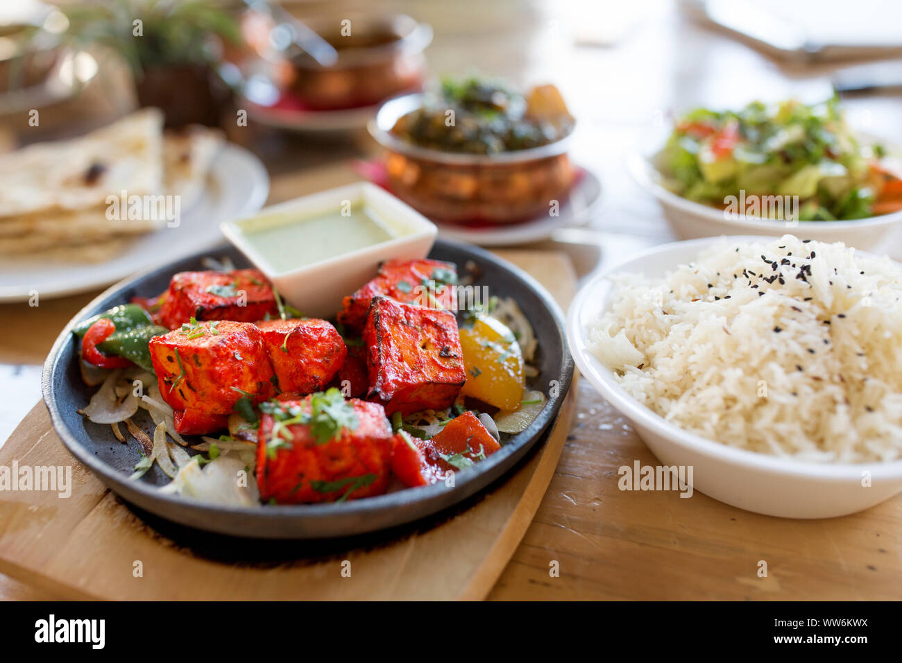 close up of paneer tikka dish with sauce on table Stock Photo