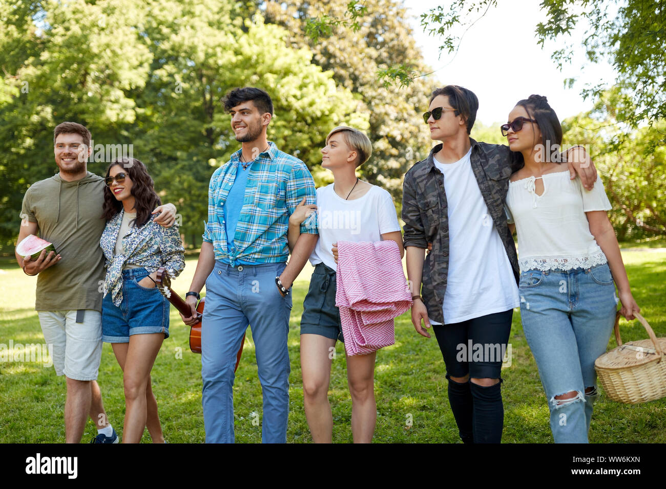 friends with guitar and picnic blanket at park Stock Photo - Alamy
