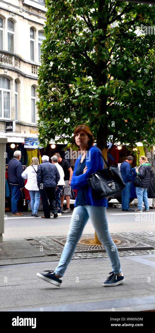 Leuven, Belgium 13 September 2019: Friday weekly market. Woman marching. Stock Photo