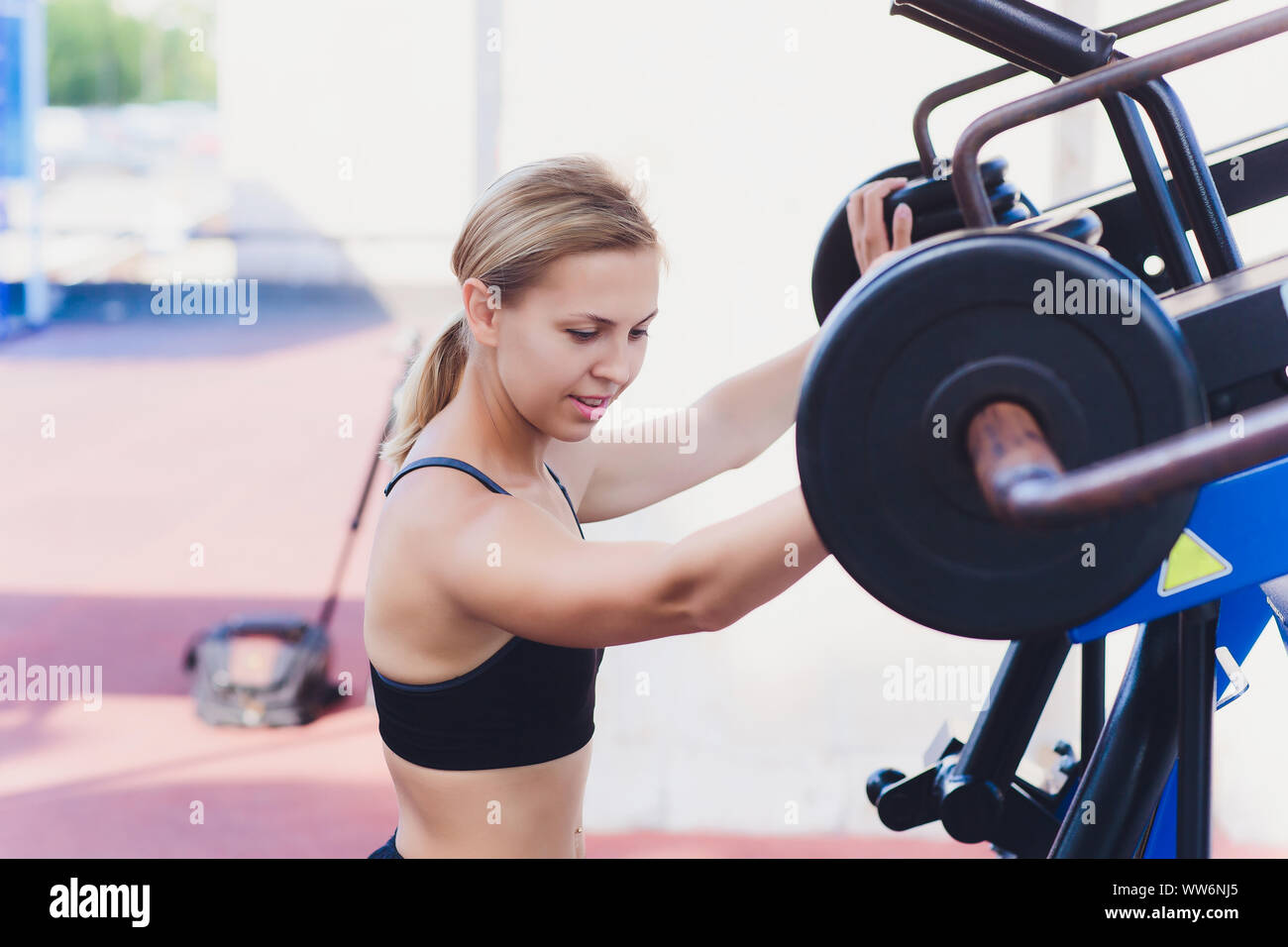 Profile View Of A Female Athlete Doing Some Tricep Dips On A Park