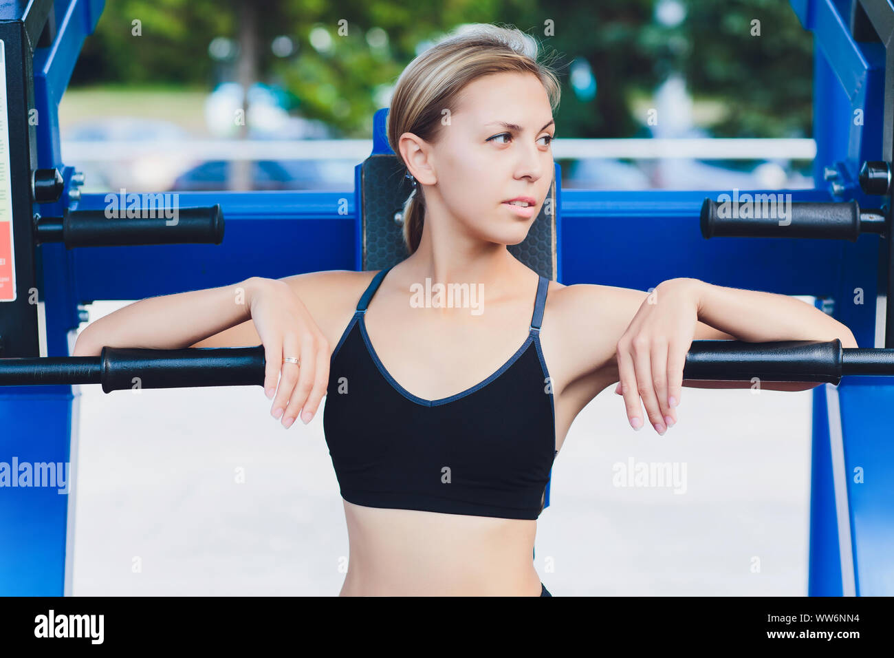 Profile View Of A Female Athlete Doing Some Tricep Dips On A Park