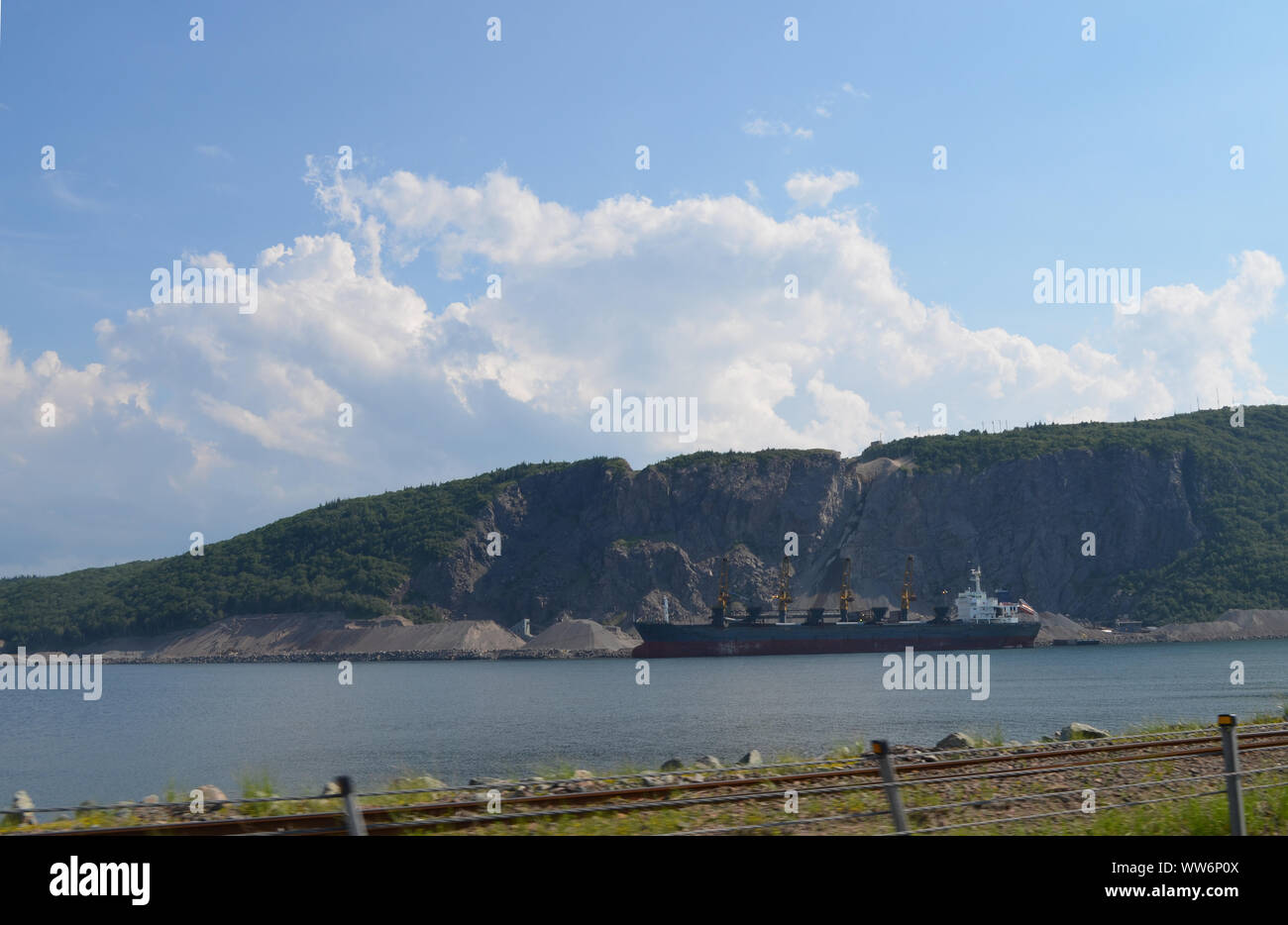 Summer in Nova Scotia: Porcupine Mountain Quarry in Aulds Cove on the Shore of Strait of Canso as seen from Canso Causeway Stock Photo