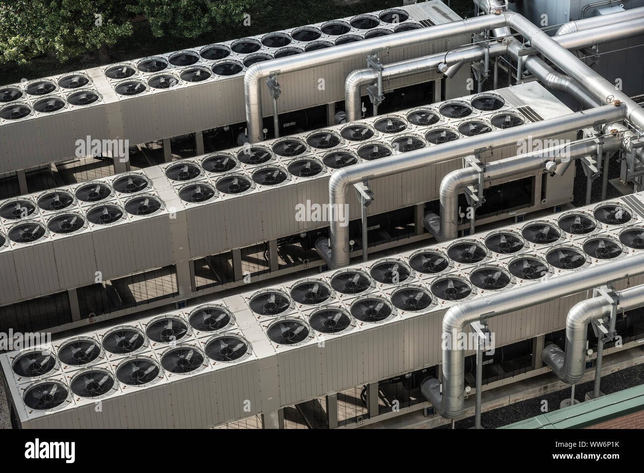 Rows of many commercial roof top air conditioners Stock Photo