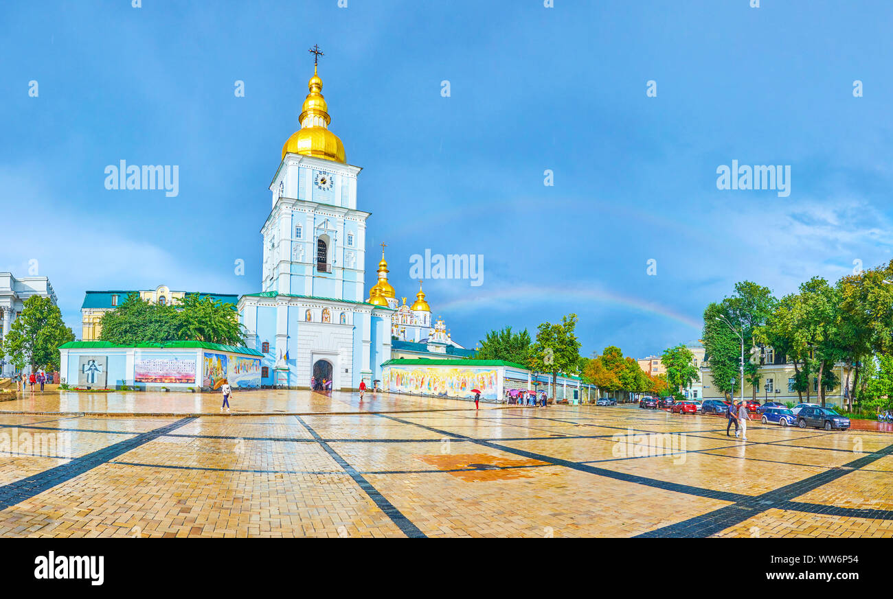 KIEV, UKRAINE - JULY 10, 2019: Panoramic view on Saint Michael sqaure with bell tower and the walls of St.Michael Cathedral with a rainbow on backgrou Stock Photo
