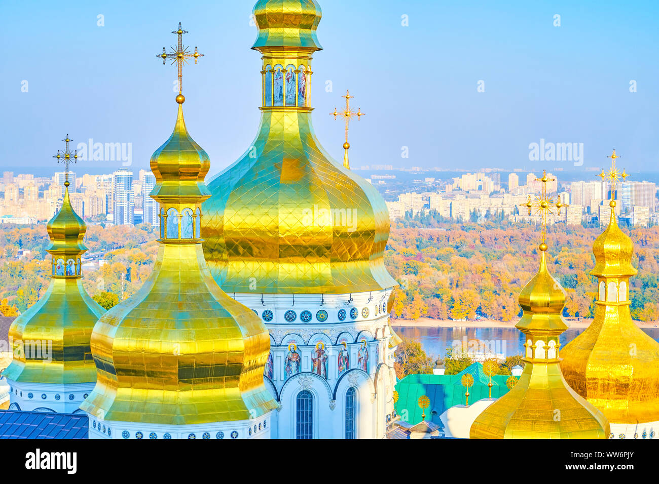 The beautiful Golden domes of Dormition Cathedral of Kiev Pechersk Lavra and the residential districts of the city on background, Ukraine Stock Photo