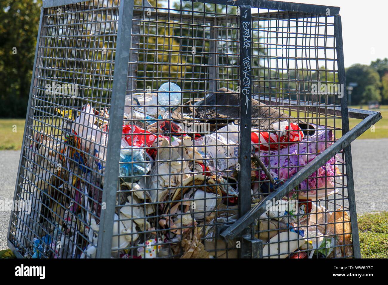 Public trash can overflowing garbage hires stock photography and