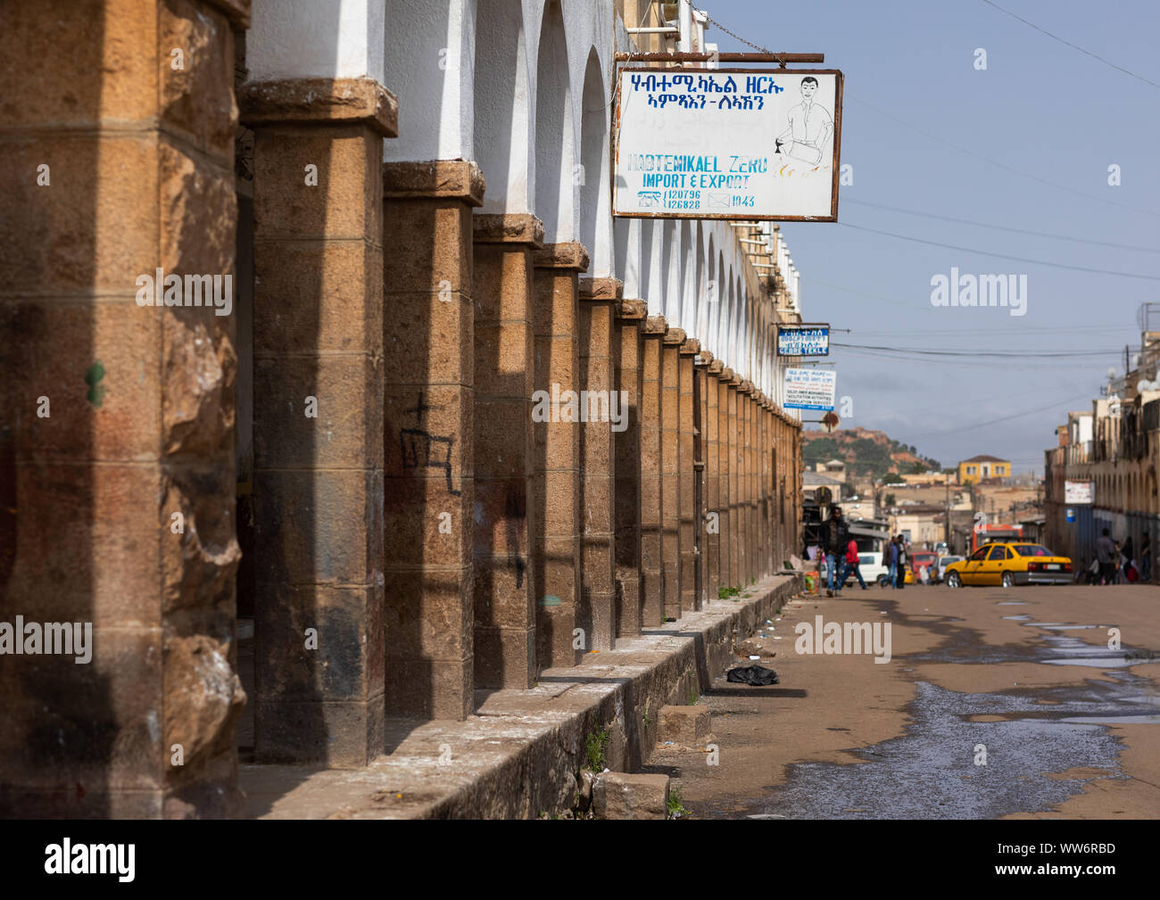 Old art deco style building with arches from the italian colonial times ...