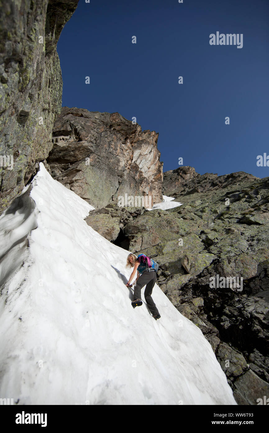 Climber on snow field in the climb to Patteriol, Verwall, Tyrol, Austria Stock Photo