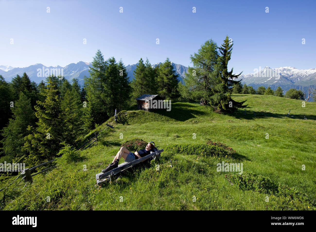 Hiker takes a break at the Weberstein, Hohe Tauern, East Tyrol, Austria. Stock Photo