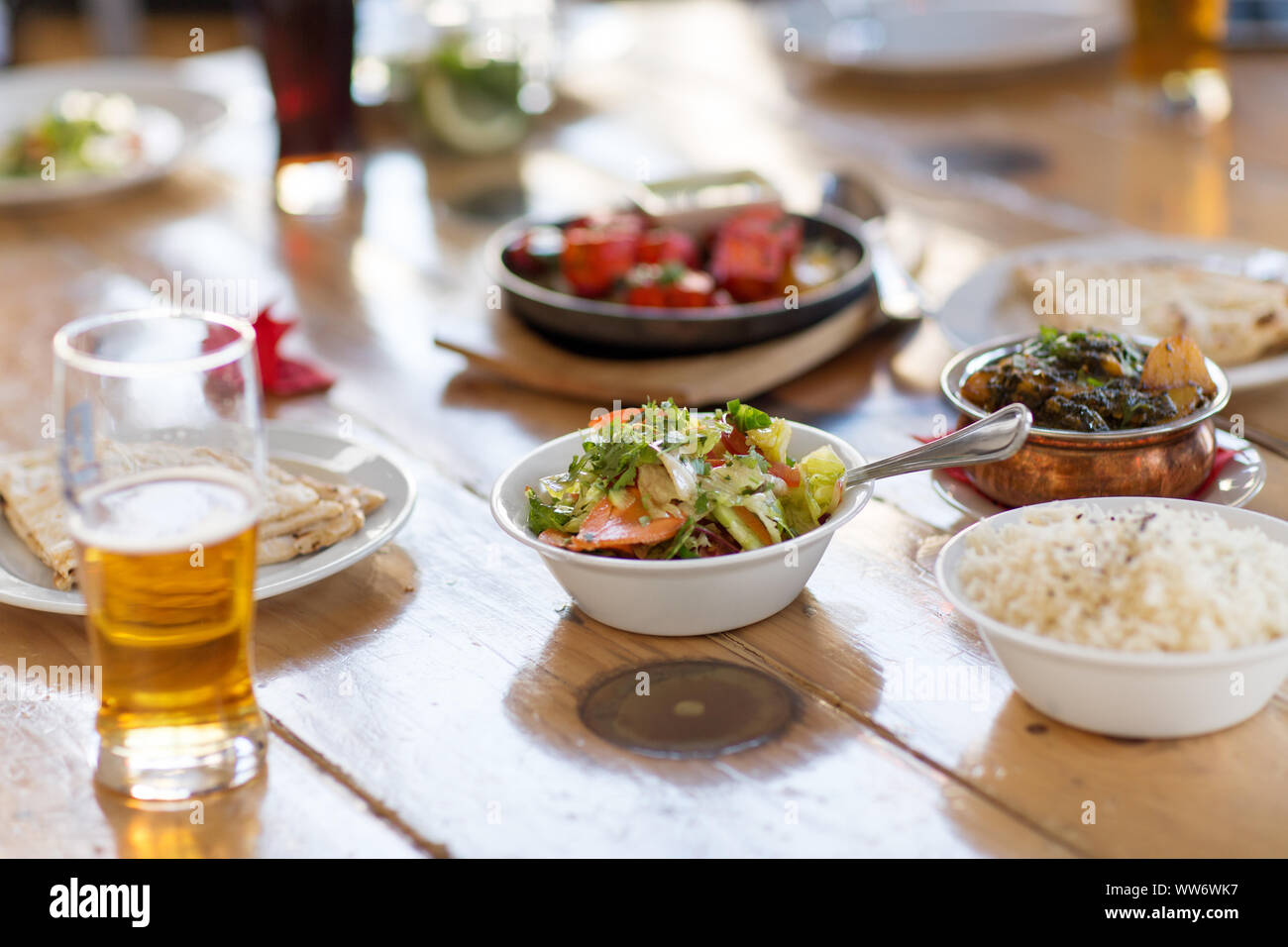 salad with other food on indian restaurant table Stock Photo