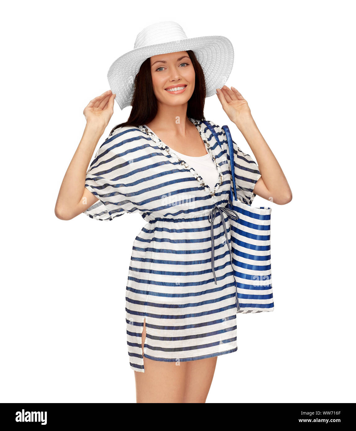 young woman in striped tunic and sun hat Stock Photo