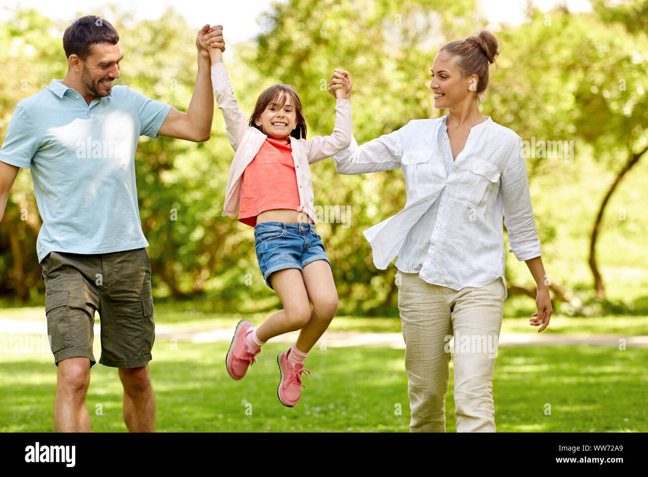 happy family walking in summer park Stock Photo - Alamy